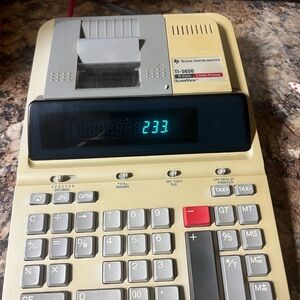 Texas Instruments Beige and Gray Calculator with Red Accent